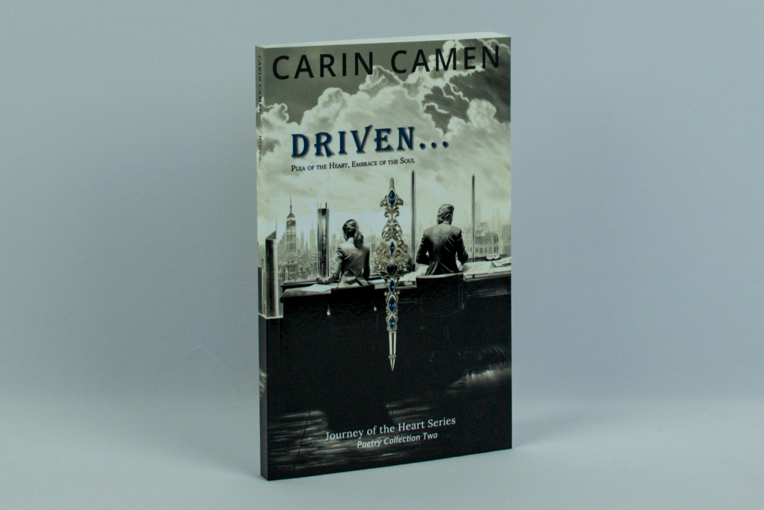 Physical copy of Carin Camen’s Driven... showing the front cover and spine of the Journey of the Heart poetry collection.