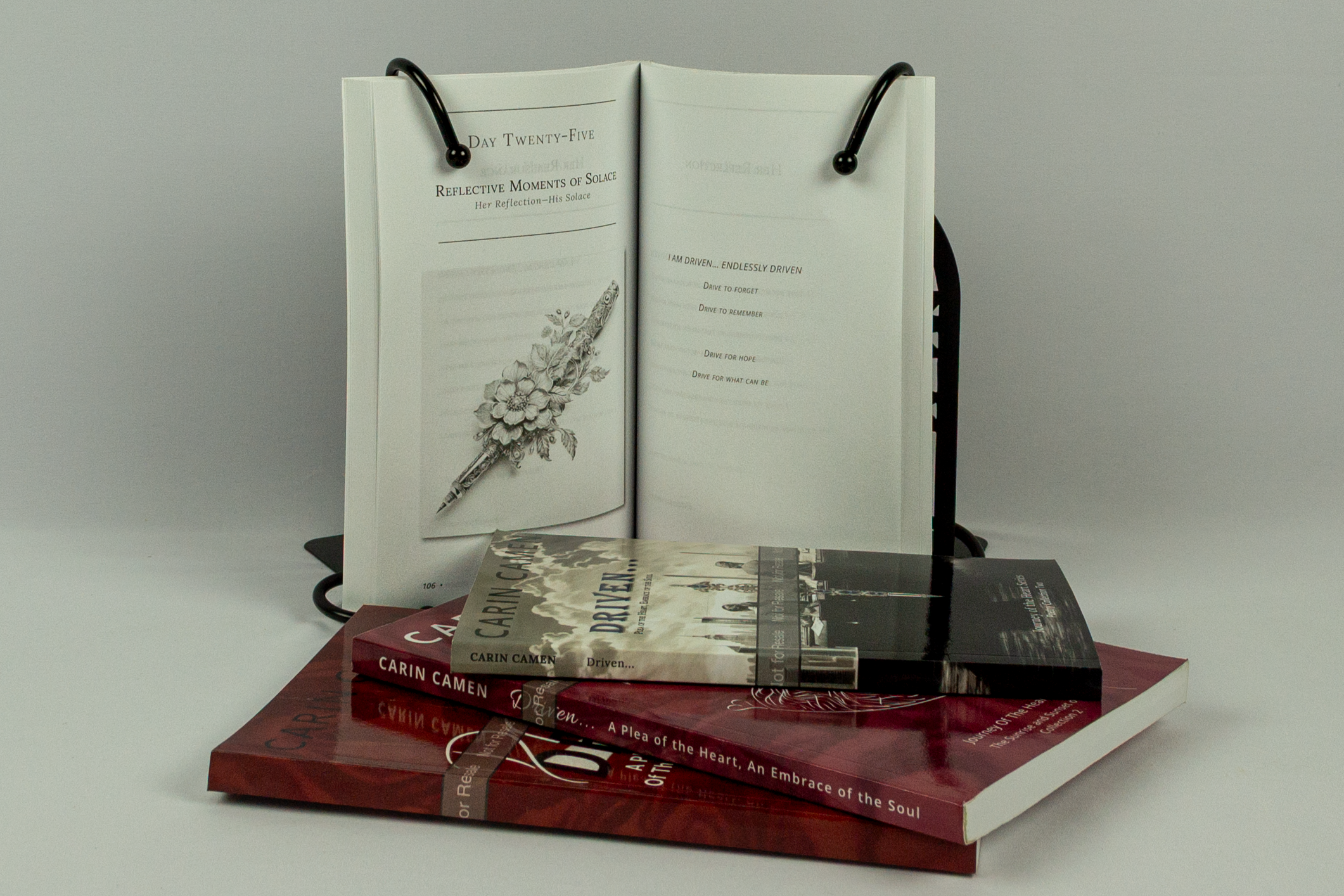 Physical copy of Carin Camen’s Driven... showing the front cover and spine of the Journey of the Heart poetry collection.